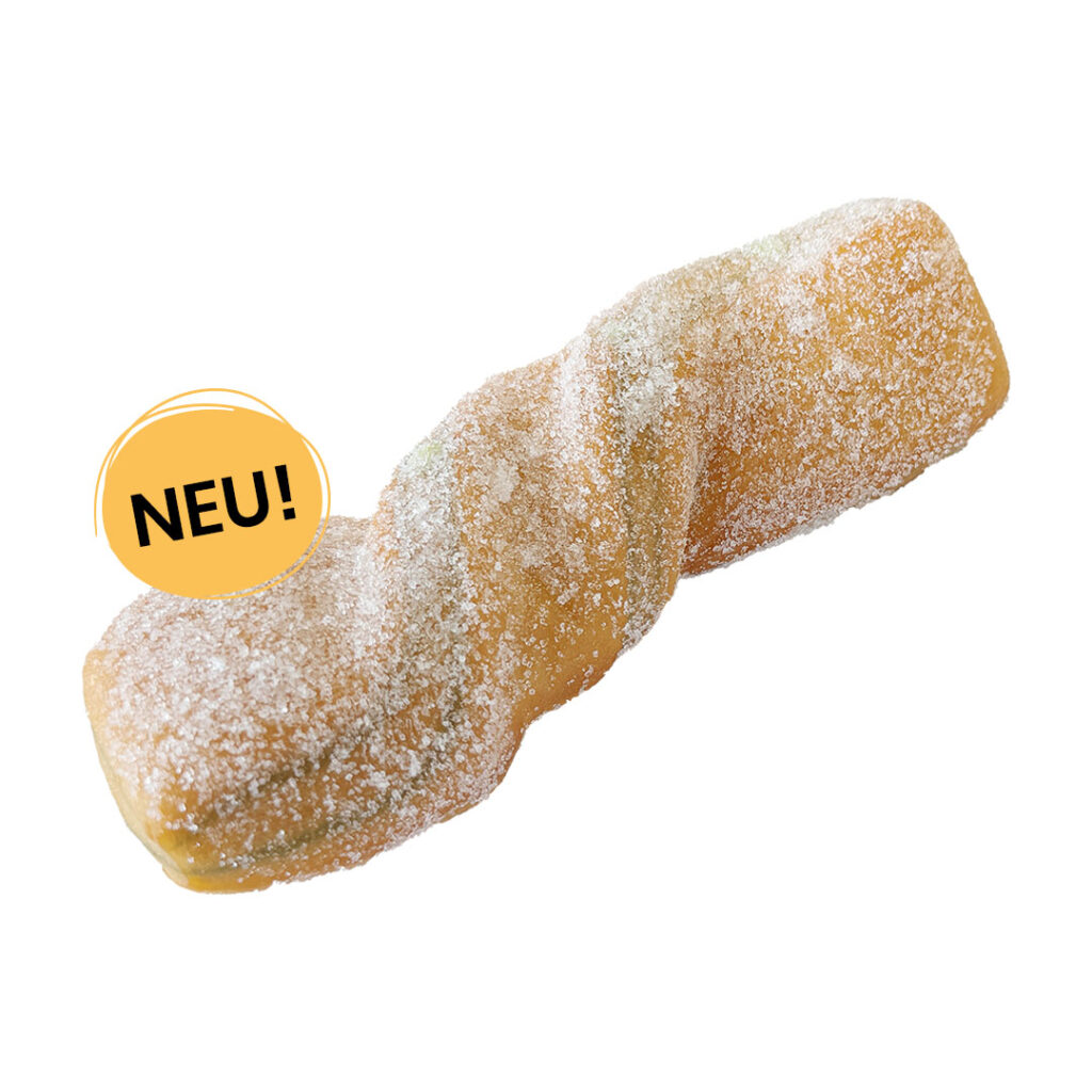 Ein Pistaziencreme Twisty, bestreut mit feinem Zucker und einem gelben Störer mit der Aufschrift 'NEU!'